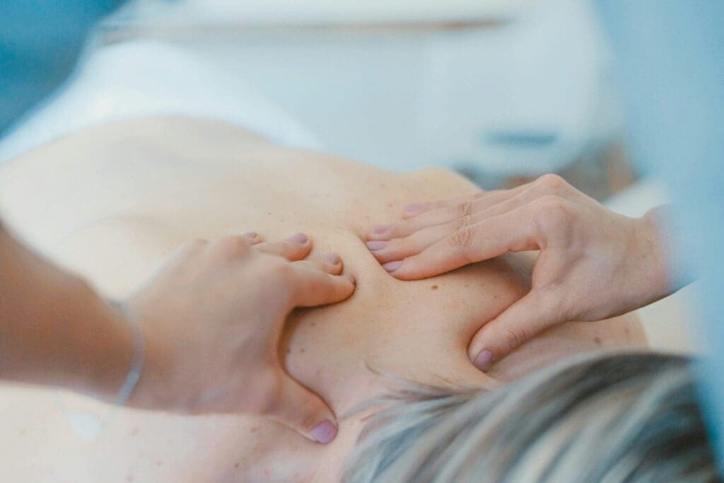 Person receiving a massage therapy treatment for relaxation and wellbeing
