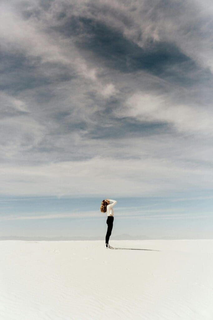 Woman enjoying a peaceful outdoor moment as a symbol of wellbeing and recovery