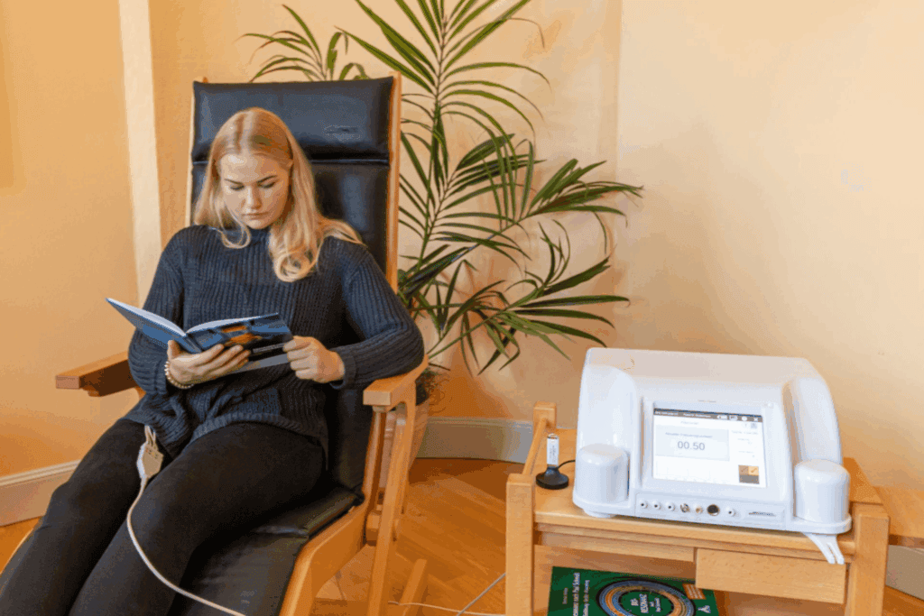 Patient receiving bioresonance therapy using a bioresonance machine